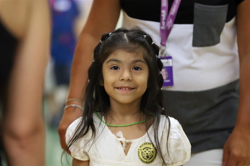 Kindergarten girl smiling.